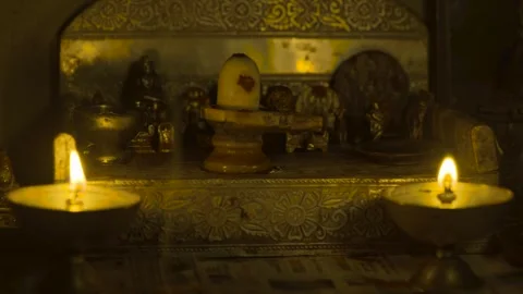 The light is burning on the lamp in front of god 4k stable short Vídeo Stock 252212464