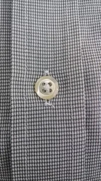 Light button sewn on shirt buttoned Stock Photos