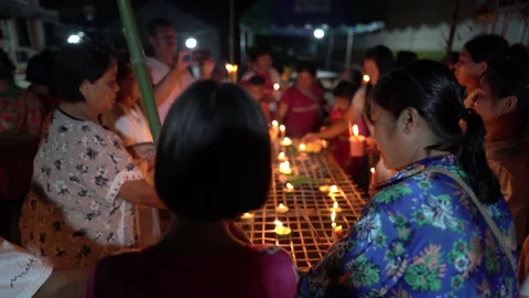Light of candle of Buddhist Lent Day activity in countryside in Thailand on nigh 動画素材 140379582