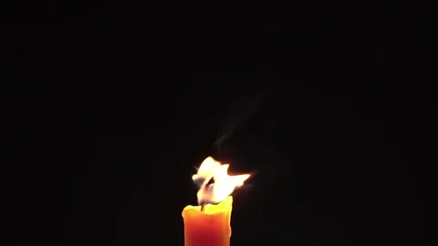 Light candle burning brightly,Candle light close up on black background. Burning Video stock 196682909