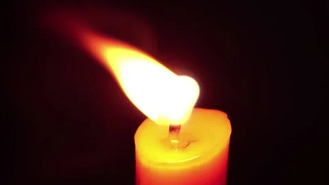 Light candle burning brightly,Candlelight close up on black background. Burning Stock Footage 196682986