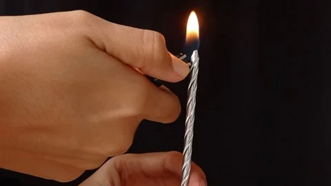 Light a candle with a gaslighter Stock Footage 149958063