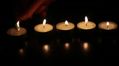 Light a candle with light reflection on black background Video stock 46583733