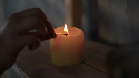 Light candle by match, close up of burning candle. Aromatherapy, massage, spa Stock Footage 212415969