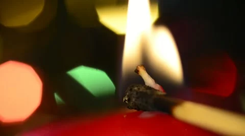 Light up a candle with a match Stock Footage 21731390