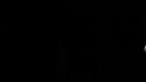 Light a candle with a match Stock Footage 83347083