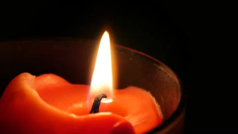 Light a candle by a match 库存影片 162602181