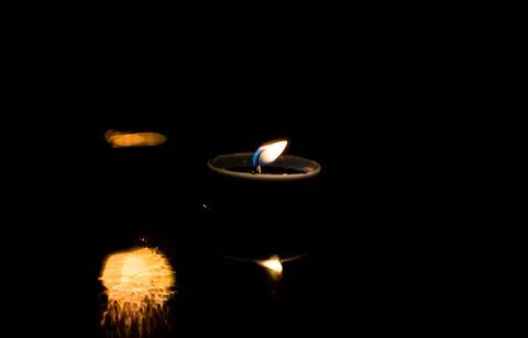 Light candle in the night. Stock Photos
