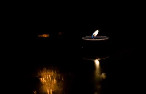 Light candle in the night. Stock Photos