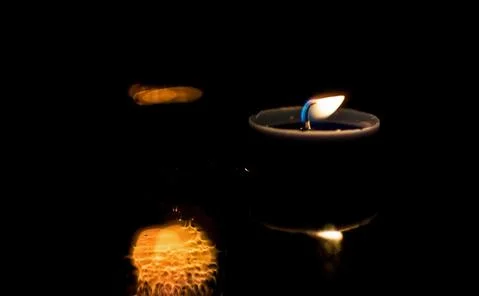 Light candle in the night. Stock Photos