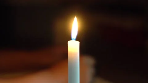 Light a candle at night, read a book and study Stock Footage 155607020