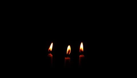 Light a candle to pray Stock Photos
