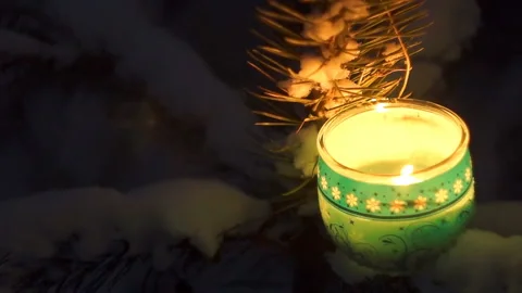 Light candles in the darkness of the night forest. Christmas Eve Stock Footage 86048581