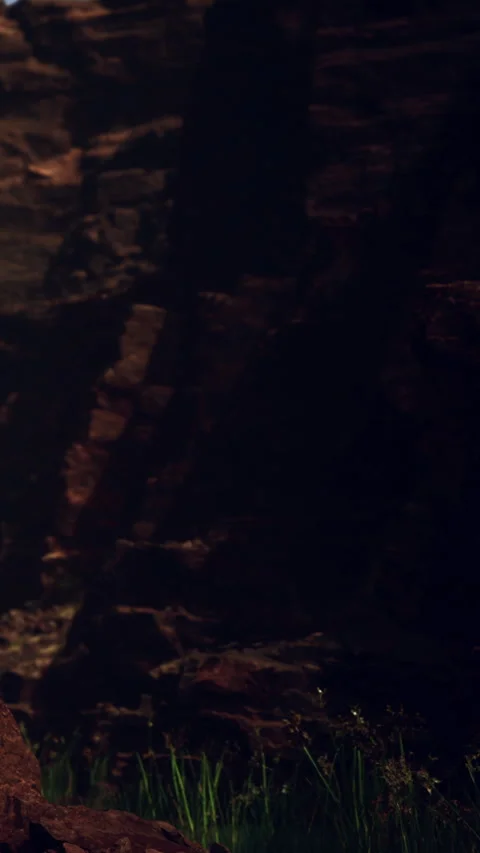 Light casts shadows on rocky surface at a canyon during sunset Vídeo Stock 346878673