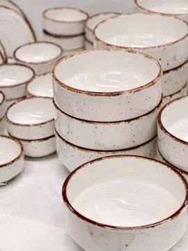 Light ceramic deep plates stacked one on top of another presented as practi.. Stock Photos