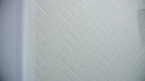 Light ceramic tiles at an angle in the bathroom Stock Footage 265614587