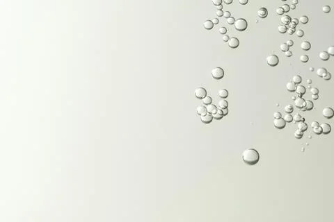 Light champagne bubbles soars over a blurred background Stock Photos