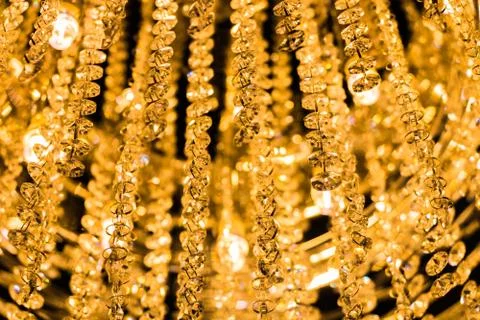 The light from the chandelier hanging from the ceiling. Stock Photos