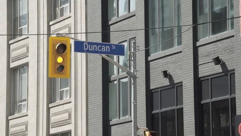 Light Changes: Green, Yellow, Red as Pedestrians pass Stock Footage 85852038