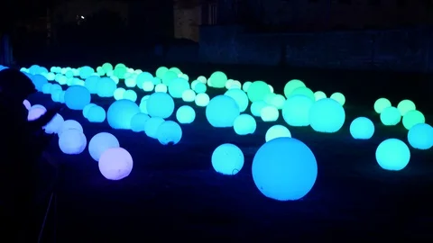 Light changing orbs display at night in York, England Stock Footage 94851258
