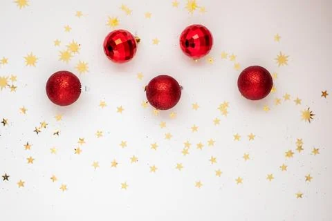 On Light Christmas background are red balls Stock Photos