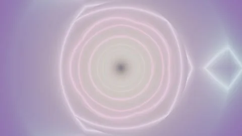 Light circles create a spiral effect in purple hues and soft tones Stock Footage 337379207