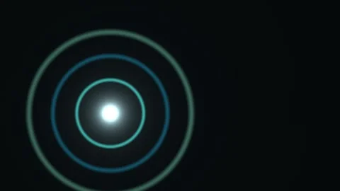 Light circles expanding in a dark space with a central glow Stock Footage 338229650