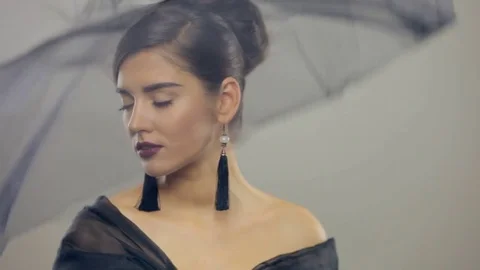 Light cloth falling on face of young beautiful woman. Slow motion Stock Footage 72148566