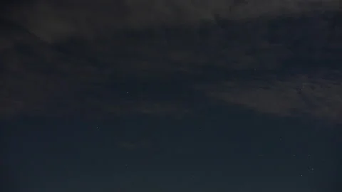 Light cloud on a starry night with seven sisters Video stock 235230338