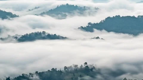 Light clouds cloud space in blue sky over the green horizon high mountains. 動画素材 336568873