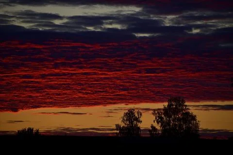 Light clouds overcast sky during summer sunset. The weather is getting worse. Stock Photos