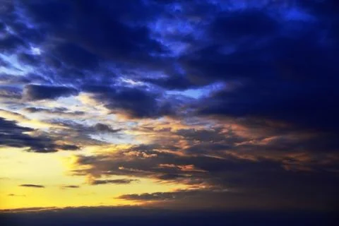 Light clouds overcast sky during summer sunset. The weather is getting worse. Stock Photos