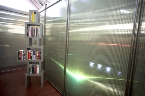 Light colorful pattern on wall books library installation by Bose Krishana... Stock Photos