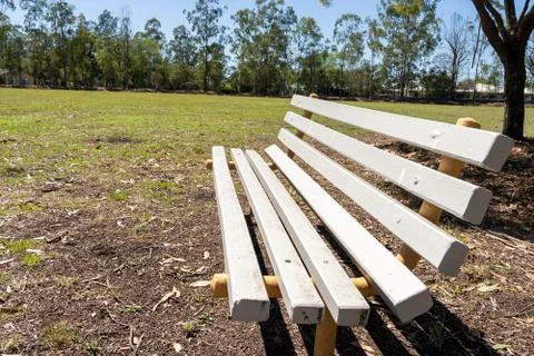 Light coloured park bench Stock Photos