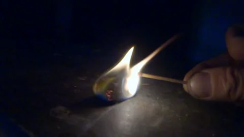 Light Comes From The Dark - Finger Hold Match That Ignite, We can All Stock Footage 223376519