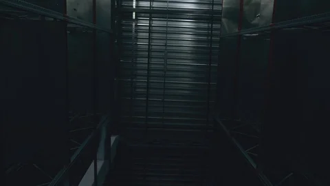 The light comes on inside the empty logistic center. Perspetive view Stock Footage 104250896