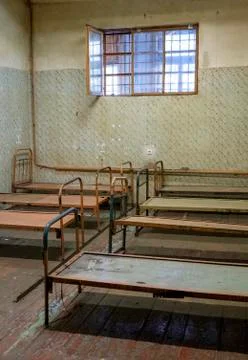 Light Coming in Through Prison Cell Bars Window. Empty Jail Cells. Prison Int Фото