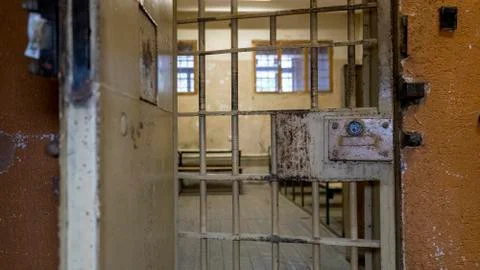 Light Coming in Through Prison Cell Bars Window. Empty Jail Cells. Prison Int Фото