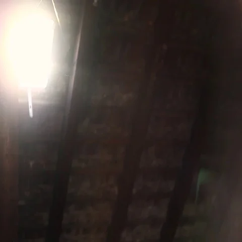 The light coming through the window in the attic, dust particles floating in the Stock Footage 69725671