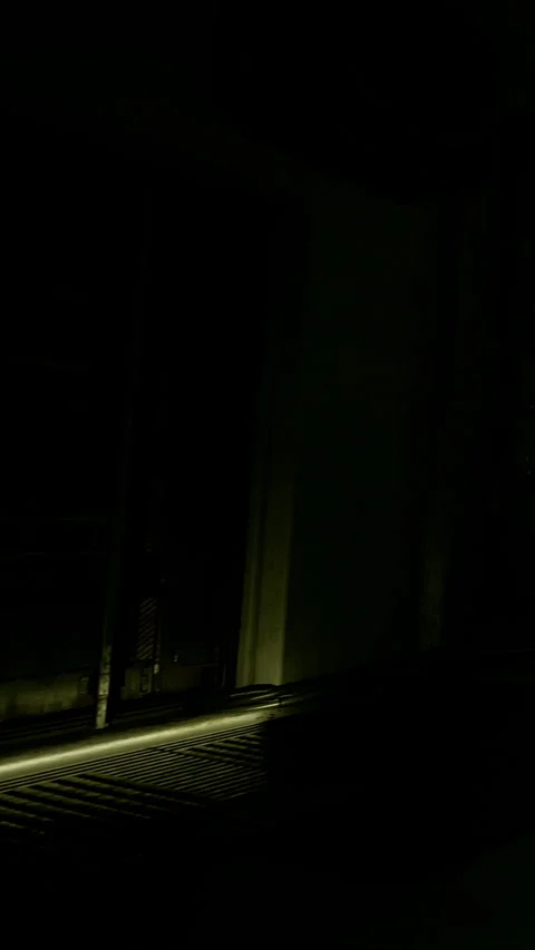 Light coming through a window in a dark room at night in an urban area Stock Footage 334310888