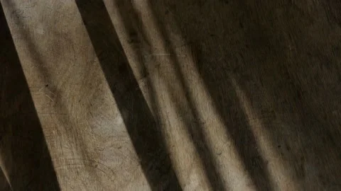 Light coming from the window passes over a wooden element. Stock Footage 149354712
