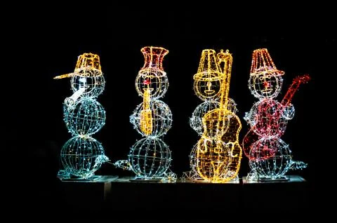 Light composition of quartet of snomen with musical instruments Stock Photos