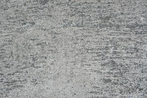 Light concrete surface with grainy stone texture pattern Stock Photos