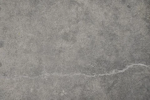 Light concrete surface with horizontal repaired crack texture Stock Photos
