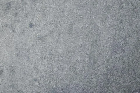 Light concrete surface with subtle natural crack texture Stock Photos