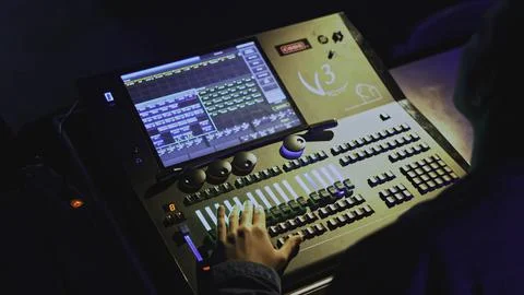 Light console control. Media. Man moves joysticks on light and sound control Stock Photos