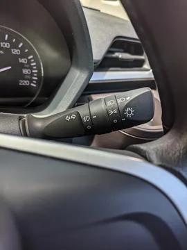 Light control of headlights adjustment lever in a car Stock Photos