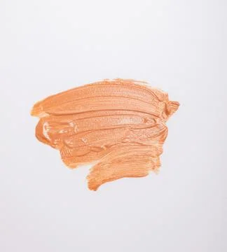 Light cosmetics make-up foundation smudge isolated on white Stock Photos