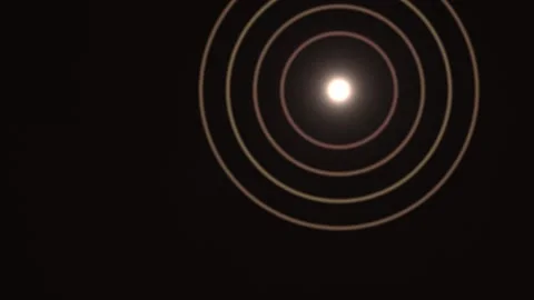 Light creates circular patterns on dark background Stock Footage 338291198