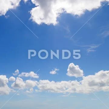Light cumulus clouds in the blue sky Stock Photos